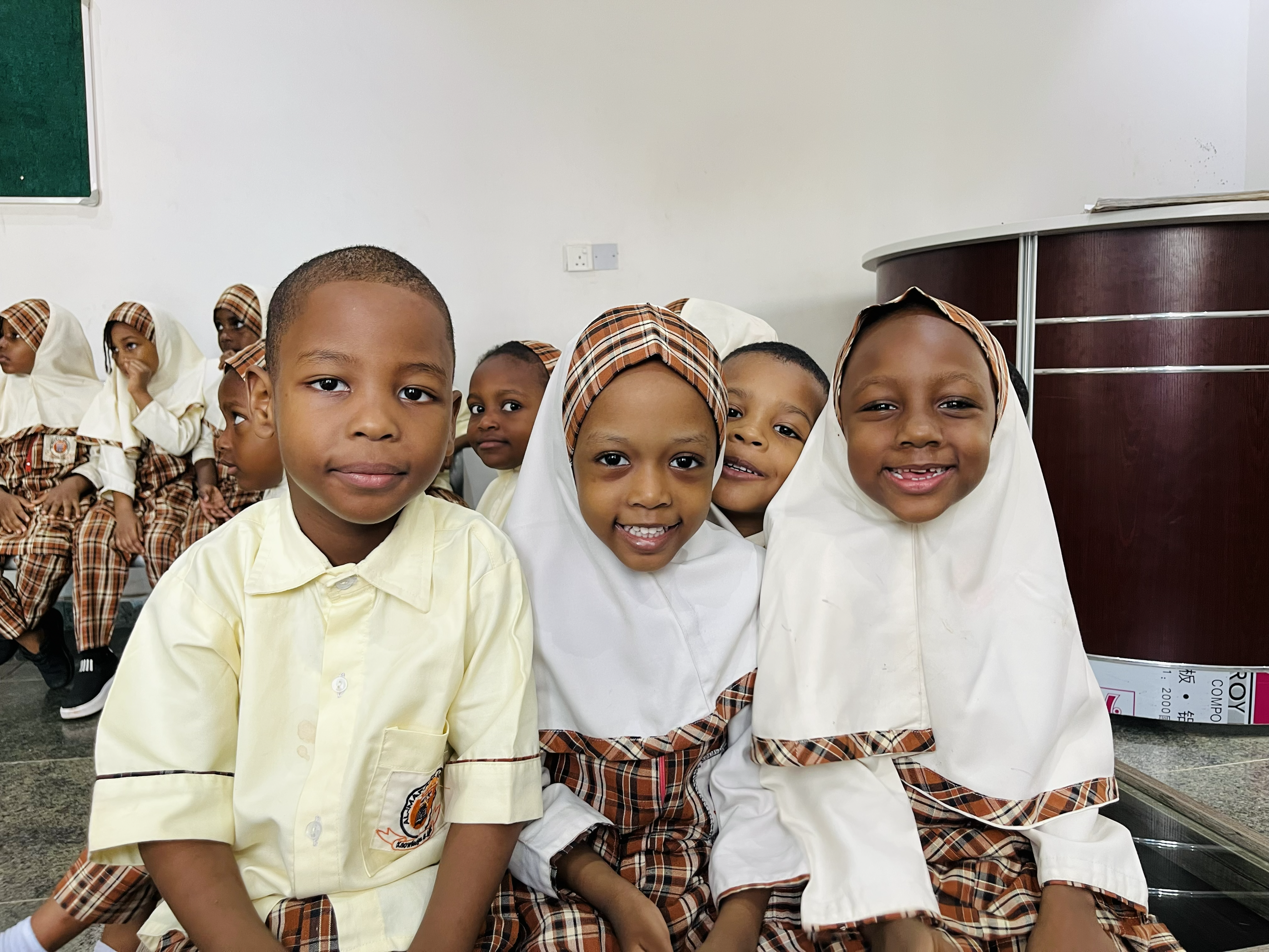 Students of Al-Mafaaz Academy gathered together outdoors