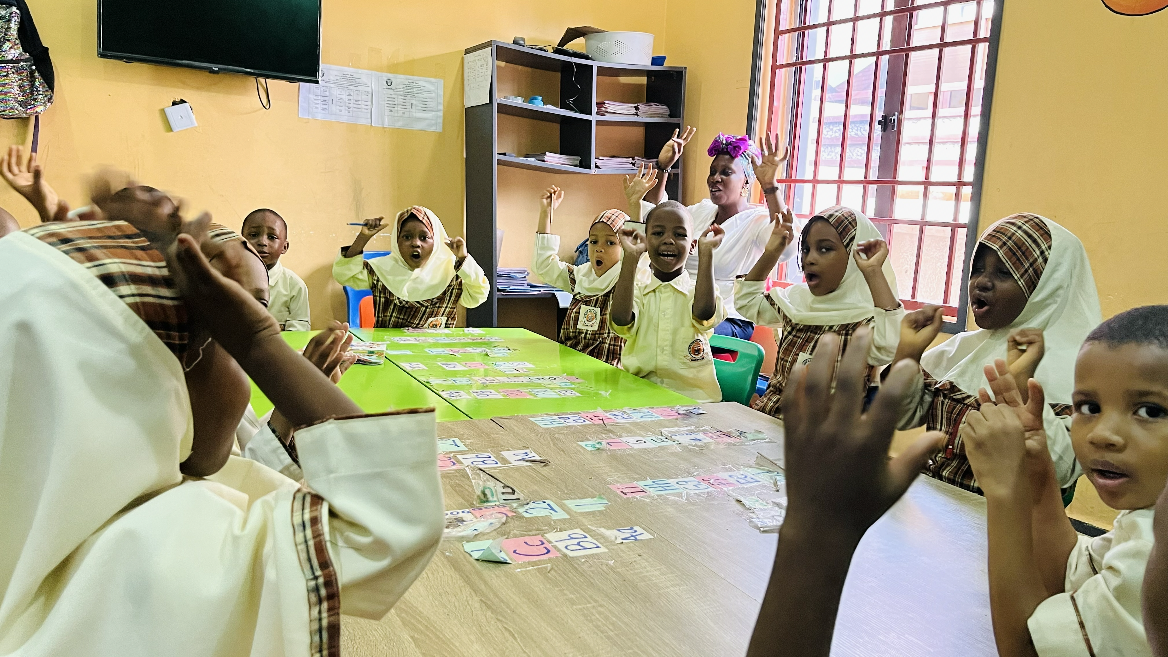 Teacher and students engaged in an interactive class activity at Al-Mafaaz Academy